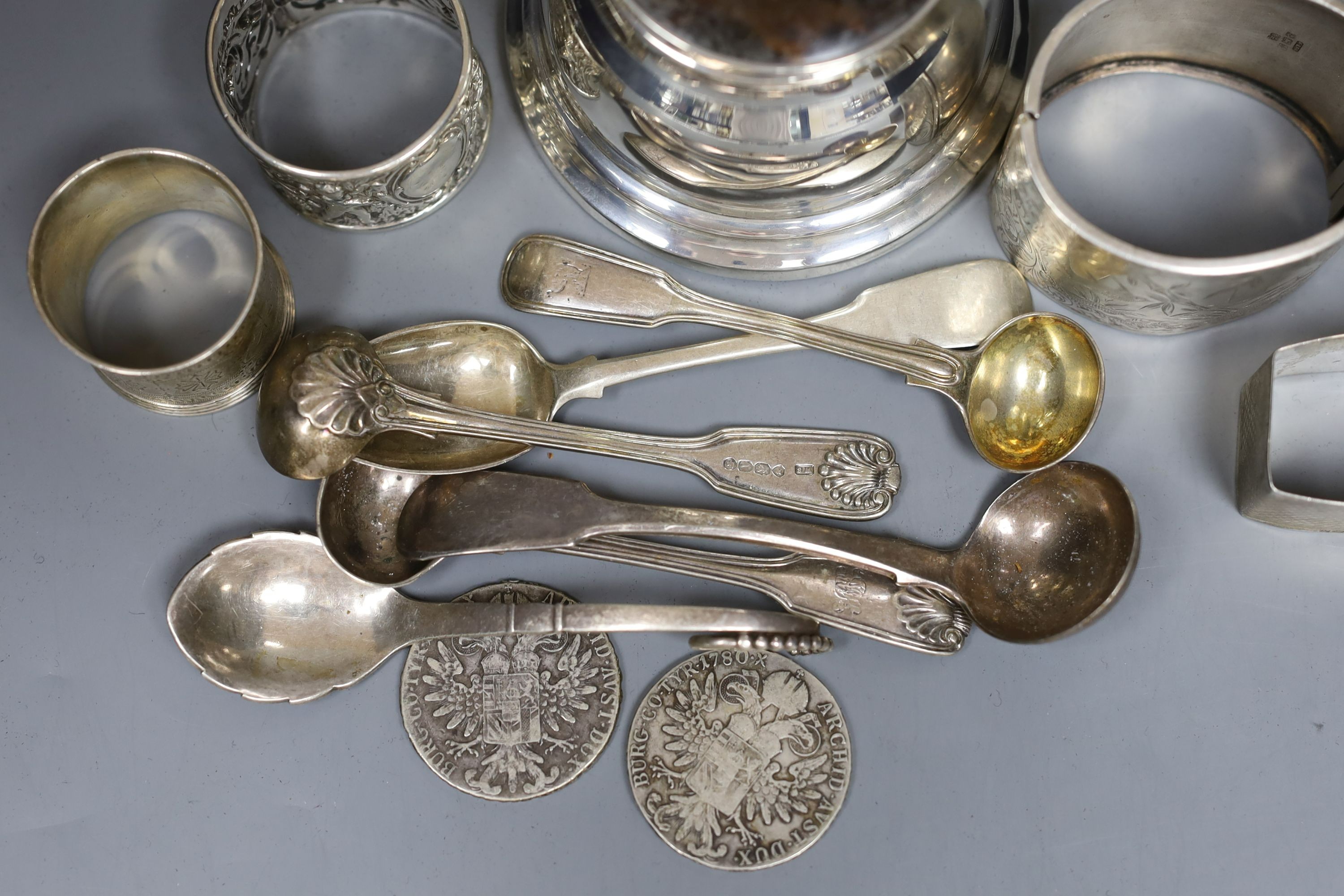 Assorted small silver including flatware, napkin rings, tortoiseshell mounted inkwell, two coins and a Georg Jensen sterling preserve spoon, no. 41.